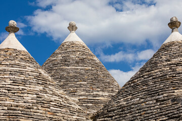 Fototapeta na wymiar Italy, Apulia, Metropolitan City of Bari, Alberobello. Trulli houses, traditional Apulian stone huts with a conical roof.