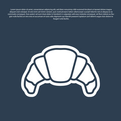 Blue line Croissant icon isolated on blue background. Vector.
