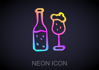 Glowing neon line Beer bottle and glass icon isolated on black background. Alcohol Drink symbol. Vector.