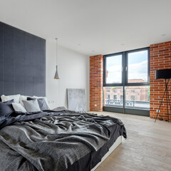 Stylish bedroom with big window