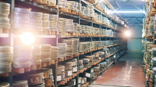Vintage film archive with packaged tapes. Vintage movie, old cinema concept.