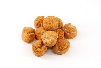 Heap of Castagnole, traditional italian carnival sweet, on white background. Here it's in the baked variant.