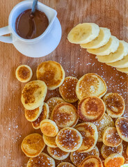 Baby sweet  pancakes with banana and chocolate praline