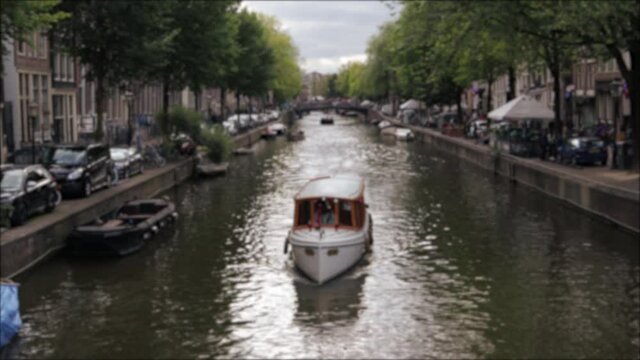 Boat on river in built up urban city