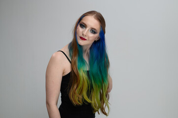 Caucasian girl with dyed hair on a white background