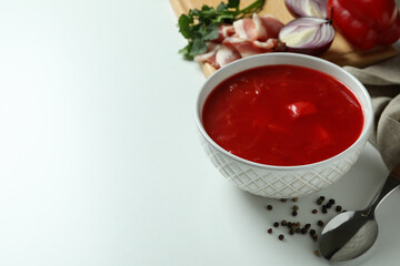 Concept of tasty eating with borscht and ingredients on white background