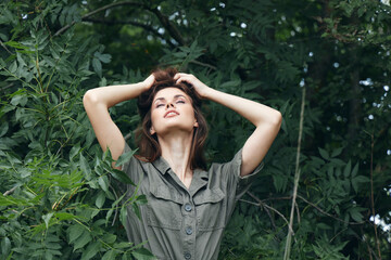 Woman in forest With her eyes closed, tilted her head back nature travel 