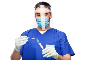 healthcare, profession and medicine concept - doctor or male nurse in blue uniform, face protective medical mask, face shield and gloves with cotton swab and test tube over white background