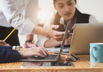 Start-up Business, a team of young entrepreneurs working together to increase profits into the company to increase business potential