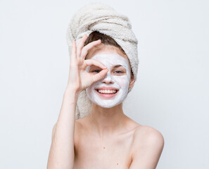 woman with bare shoulders face mask clean skin