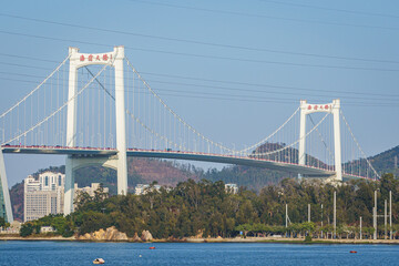 Distance view of the Haicang Bridge against blue sky and sea, which connects Xiamen Island and Haicang District