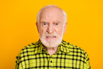 Photo of angry old man pensioner unhappy mad crazy conflict disagreement isolated over yellow color...
