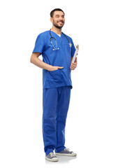 healthcare, profession and medicine concept - happy smiling doctor or male nurse in blue uniform with stethoscope and clipboard over white background