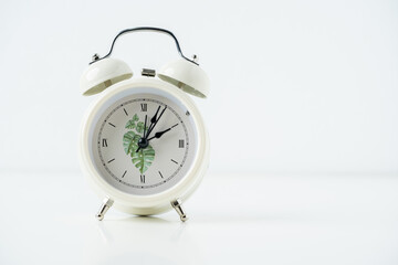 Close up white alarm clock on the white background.