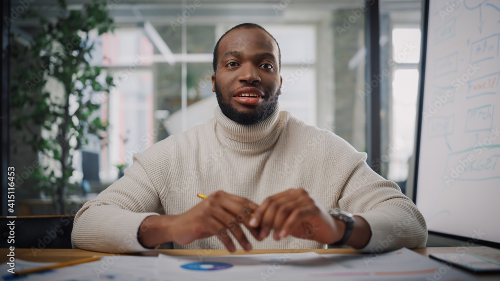 Poster Point of View from Camera with Handsome Young Black Project Manager Making a Video Call in Creative Office Environment. Happy African American Male Specialist Talking to Colleague Over a Live Camera.