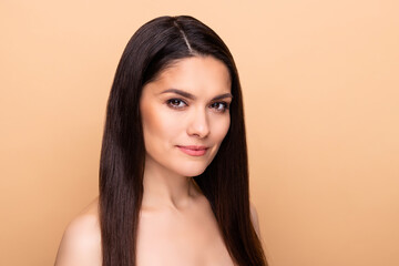 Naklejka premium Profile portrait of nice serious brunette long hairdo lady without clothes isolated on pastel beige color background