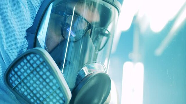 Face of a laboratory specialist wearing a hazmat mask