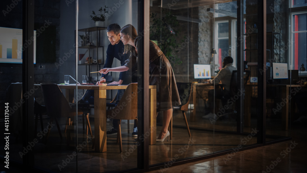 Aufkleber two young and successful colleagues have a conversation in a meeting room behind glass walls in an a