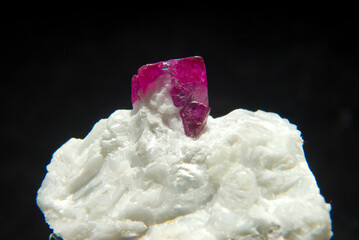 Closeup shot of a Ruby stone isolated on a black background