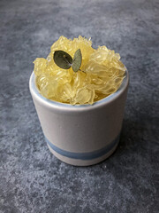 oroblanco in a cup topped with eucalyptus