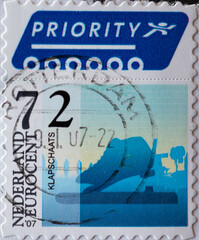 NETHERLANDS - CIRCA 2007: a postage stamp for priority delivery printed in the netherlands showing special ice scating shoes for icescating races so-called clapskates.