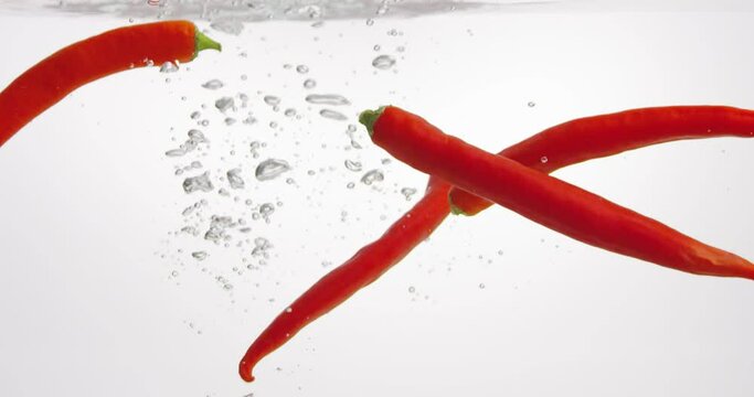 Red peppers floating in the water