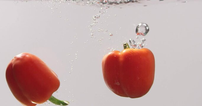 Red paprika floating in the saucepan