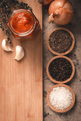 Ingredients, tomato puree, herbs, spices, space to write recipes