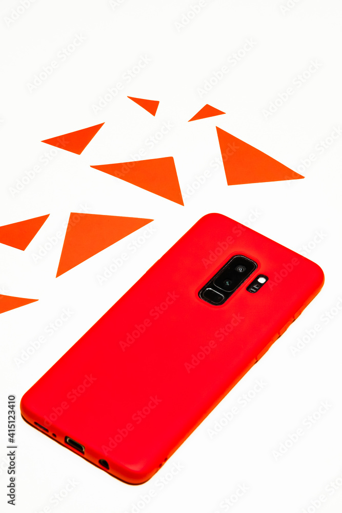 Poster vertical shot of a red mobile phone in the white background with red triangular parts