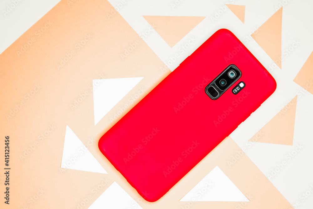 Poster red mobile phone isolated on the white background with red triangular parts