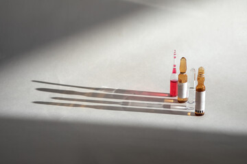 Vaccines Used for prevention, immunity and treatment from covid-19 infection or coronavirus. Concepts of disease prevention. Focus on vial, blurred background.