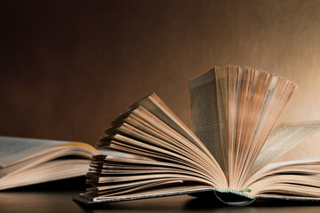 Open books lying on the table.