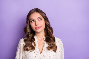 Photo of young pretty lovely charming serious minded girl look copyspace thinking isolated on violet color background