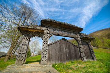 Traditional sculptured wooden gate at Barsana Monastery, Maramures, Romania