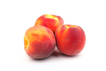 Summer fruit background. Ripe juicy peaches on white background. Copy space. Fresh organic fruit vegan food. Harvest concept