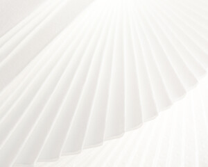 Abstract photo of a stack of softened cream-coloured napkins