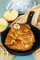 Homemade sweet apple pancakes with grated apples and cinnamon