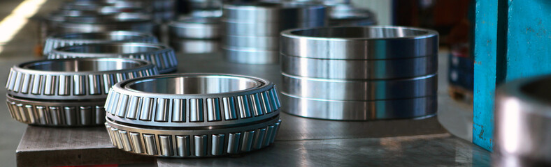Ready-made large-diameter bearings. Metal products. A narrow banner.Heavy industry. Photo at the...