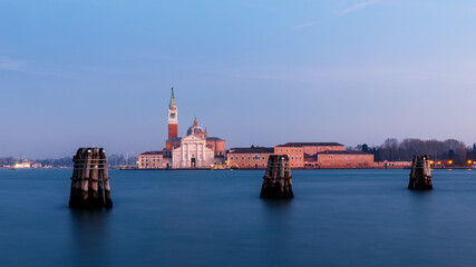 Fototapeta na wymiar Venice Canal Grande at blue hour with view of church and tower