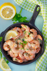 Creamy garlic prawns in coconut sauce with parsley