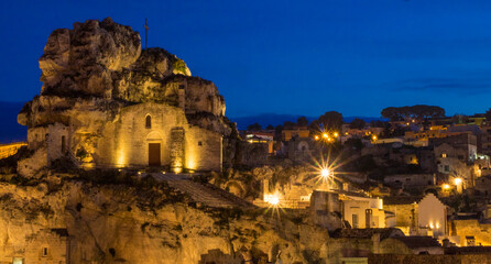 The Roman Catholic church of Santa Maria de Idris, cut into the rock in Matera at night.