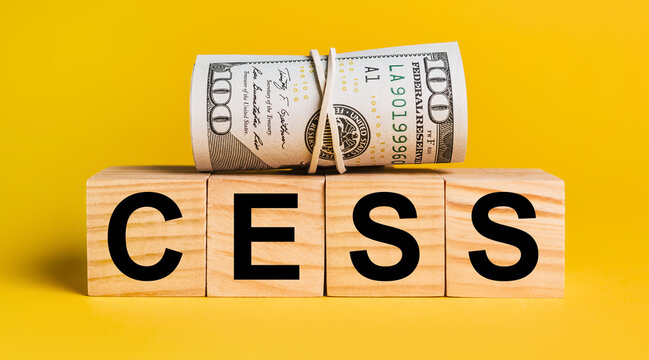 cess with money on a yellow background. The concept of business, finance, credit, income, savings, investments, exchange, tax