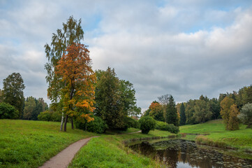 Pavslovsky park early autumn, pathway and river