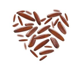 Raw brown rice in the shape of a heart on a white background