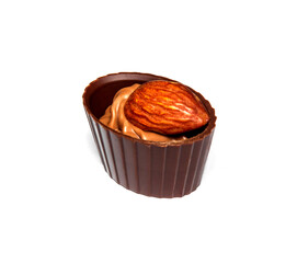 Chocolate candy with cream and nuts almond on a white isolated background. Idea for dessert in restauran