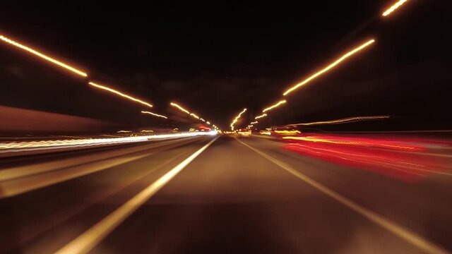 Pov car hyperlapse traffic at night in the highway