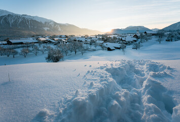 Snow covered rural winter landscape during sunset, Wildermieming, Tirol, Austria
