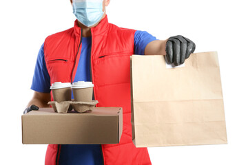 Courier in medical mask holding packages with takeaway food and drinks on white background, closeup. Delivery service during quarantine due to Covid-19 outbreak