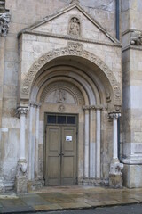 Fototapeta na wymiar Fidenza, Italy: Cathedral of San Donnino, detail of the entrance door