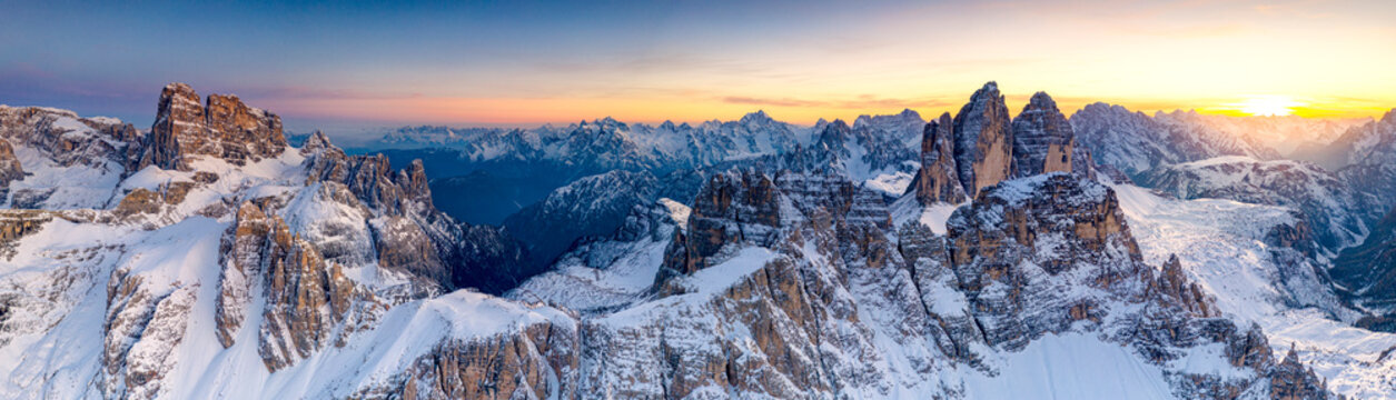 Sunset on the snow capped Tre Cime Di Lavaredo, Monte Paterno and Croda Dei Toni, Sesto Dolomites, border of South Tyrol and Veneto